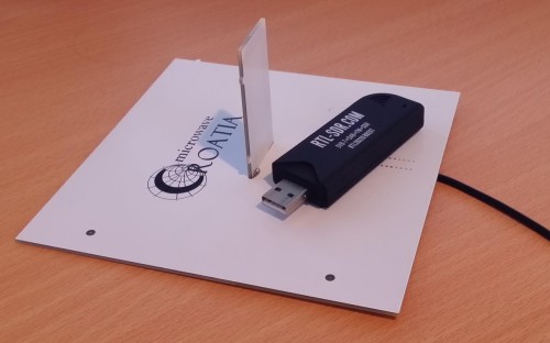 Fully constructed ADS-B antenna with RTL-SDR dongle for size comparison.