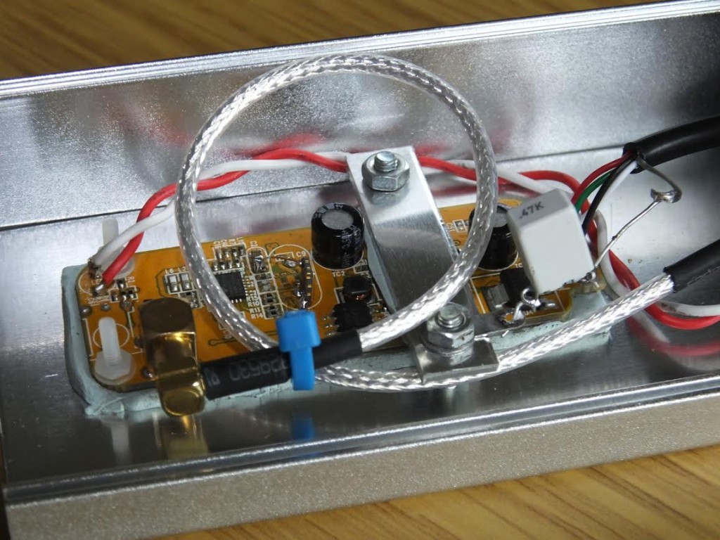 Inside latest SDR / Latest SDR - "This is my latest version using a R820T2 version, and I have also fitted this with a TCXO. In this version I also used a 1Mohm and 47nF to ground the USB shield wire as in a previous post. This version only uses one metal spacer and the end  of the PCB is secured by two M2 nylon screws / nuts. Case from China RF on Ebay."