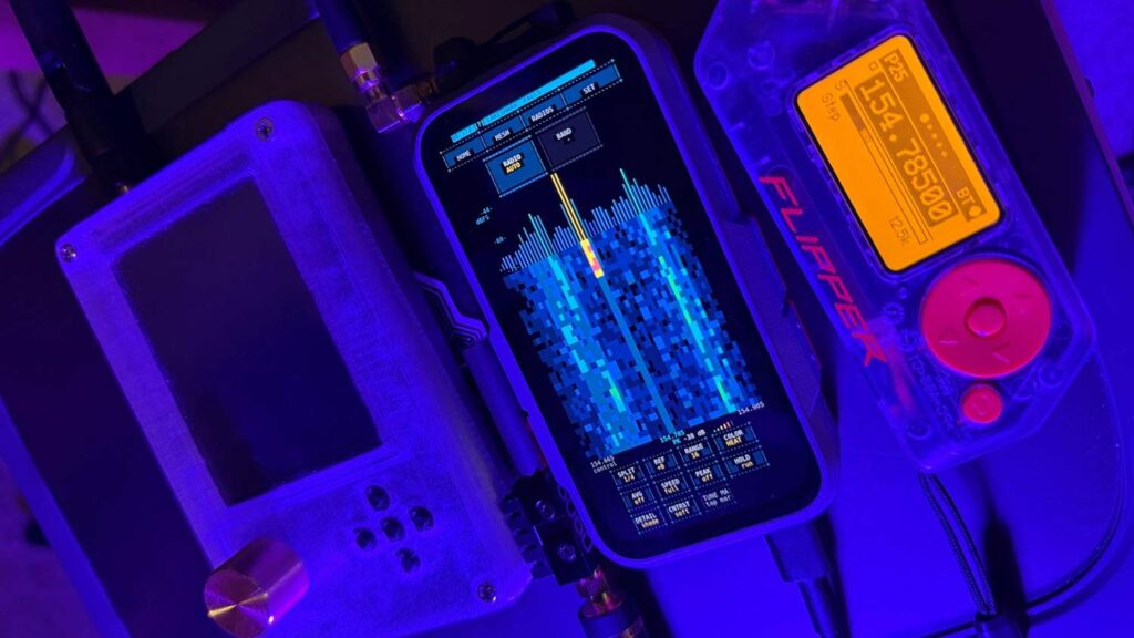 LakeShark Running on A LilyGO T-Display-P4 next to a HackRF (left) and Flipper Zero (right).